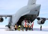 A helicopter being unloaded from the back of a large grey air force plane The helicopters will be used to fly scientists to remote locations in the Bunger Hills region. Photo: Simon Payne