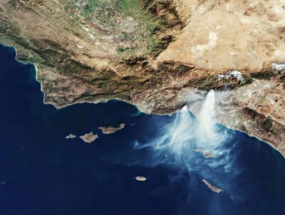 Weather Whiplash is Amplifying Wildfire Risk 1 This satellite image shows smoke from the Palisades and Eaton Fires spreading over the region on January 9, 2025. Credit: ESA