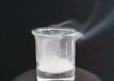 Trifluoroacetic acid in a beaker. The fumes can be clearly seen. © TimJW12 / CC BY-SA 4.0